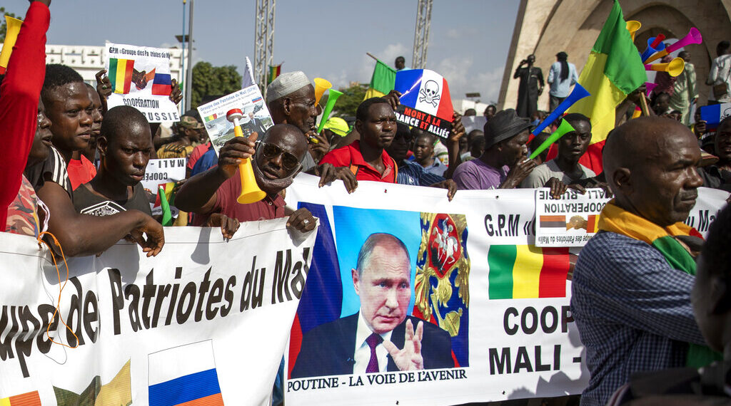 Malians demonstrate against France and in support of Russia on the 60th anniversary of the independence of the Republic of Mali in 1960, in Bamako, Mali Tuesday, Sept. 22, 2020. Junta leader and now vice-president of the transitional government Col. Assimi Goita on Tuesday promised to "build a new Mali, a new Malian". Banner in French reads "Putin, the road to the future". (AP Photo)