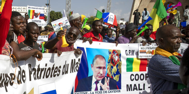 Malians demonstrate against France and in support of Russia on the 60th anniversary of the independence of the Republic of Mali in 1960, in Bamako, Mali Tuesday, Sept. 22, 2020. Junta leader and now vice-president of the transitional government Col. Assimi Goita on Tuesday promised to "build a new Mali, a new Malian". Banner in French reads "Putin, the road to the future". (AP Photo)