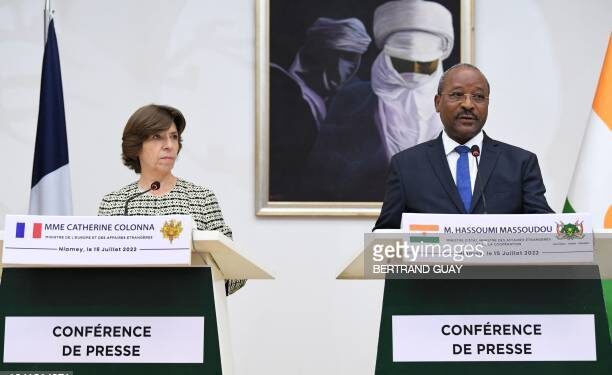 Niger Minister of Foreign Affairs and Cooperation Hassoumi Massaoudou (R) speaks to French Foreign Minister Catherine Colonna (L) during a joint press conference at the presidency in Niamey on July 15, 2022. - The French Foreign Minister and French Armies Minister began an official visit to Niger on July 15, 2022, Paris's key partner in the Sahel, at a time when France is seeking to redefine its military and diplomatic offer in Africa. (Photo by BERTRAND GUAY / AFP) (Photo by BERTRAND GUAY/AFP via Getty Images)