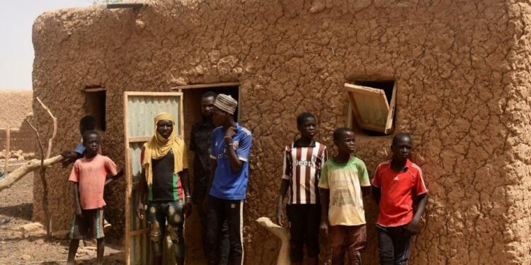 Residents of Zibane-Koira Zéno, a village in the Tillabéri region (western Niger close to Mali) attends a meeting on May 12, 2020, after an attack by armed men on May 8, 2020. (Photo by BOUREIMA HAMA / AFP)