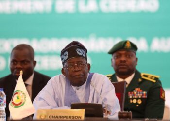 Chairperson of Economic Community of West African States (ECOWAS) and President of Nigeria, Bola Ahmed Tinubu, reacts while addressing the ECOWAS head of states and government, following Niger's military junta, in Abuja Nigeria on July 30, 2023. West African leaders were to meet on Sunday for a crisis summit on the coup in Niger, where protesters tried to storm the French embassy after the junta warned of an "imminent military intervention". In the third coup to fell a leader in Africa's restive Sahel region in as many years, Niger's elected president, Mohamed Bazoum, has been held by the military since Wednesday. (Photo by Kola SULAIMON / AFP)