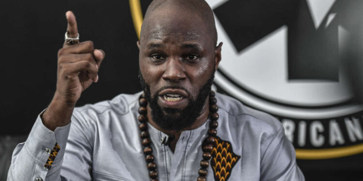 French anti-colonial activist Kemi Seba  addresses a press conference on June 26, 2020 in Paris. (Photo by STEPHANE DE SAKUTIN / AFP)