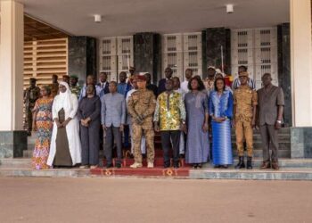 Members of the newly appointed Burkina Faso government, including Prime Minister Apollinaire Kyelem de Tembela (4L front line), pose for a family photo following the first minister's council after cabinet appointments in Ouagadougou, on October 26, 2022. - Burkina Faso's new government on October 26, 2022, has declared that its top priority would be to secure the nation's territory, after the latest coup to rock the jihadist-torn Sahel state. (Photo by OLYMPIA DE MAISMONT / AFP)