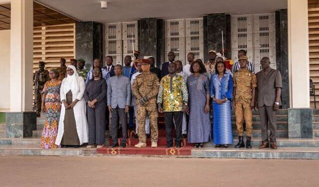 Members of the newly appointed Burkina Faso government, including Prime Minister Apollinaire Kyelem de Tembela (4L front line), pose for a family photo following the first minister's council after cabinet appointments in Ouagadougou, on October 26, 2022. - Burkina Faso's new government on October 26, 2022, has declared that its top priority would be to secure the nation's territory, after the latest coup to rock the jihadist-torn Sahel state. (Photo by OLYMPIA DE MAISMONT / AFP)