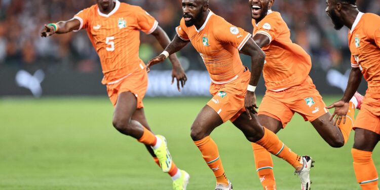 Ivory Coast's midfielder #6 Seko Fofana (C) celebrates scoring his team's first goal during the Africa Cup of Nations (CAN) 2024 group A football match between Ivory Coast and Guinea-Bissau at the Alassane Ouattara Olympic Stadium in Ebimpe, Abidjan, on January 13, 2024. (Photo by FRANCK FIFE / AFP)