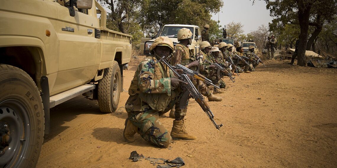 Nigerien soldiers wait for instructions before attacking a enemy command and control node, during training at Camp Po, Burkina Faso, on Feb. 20, 2019, during Flintlock 19. Flintlock is an annual special operations and State Department exercise involving more than 2,000 soldiers, airmen, naval and police forces from more than 30 nations. Lessons learned at Flintlock strengthen global security institutions, promote multinational sharing of information, and develop interoperability among western and partner nations in North and West Africa. (Army photo by Richard Bumgardner)