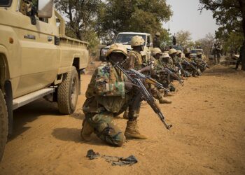 Nigerien soldiers wait for instructions before attacking a enemy command and control node, during training at Camp Po, Burkina Faso, on  Feb. 20, 2019, during Flintlock 19.  Flintlock is an annual special operations and State Department exercise involving more than 2,000 soldiers, airmen, naval and police forces from more than 30 nations.  Lessons learned at Flintlock strengthen global security institutions, promote multinational sharing of information, and develop interoperability among western and partner nations in North and West Africa. (Army photo by Richard Bumgardner)