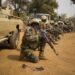 Nigerien soldiers wait for instructions before attacking a enemy command and control node, during training at Camp Po, Burkina Faso, on  Feb. 20, 2019, during Flintlock 19.  Flintlock is an annual special operations and State Department exercise involving more than 2,000 soldiers, airmen, naval and police forces from more than 30 nations.  Lessons learned at Flintlock strengthen global security institutions, promote multinational sharing of information, and develop interoperability among western and partner nations in North and West Africa. (Army photo by Richard Bumgardner)